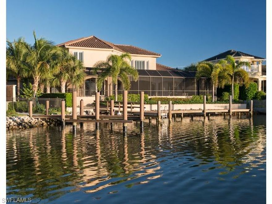 Enjoy outstanding sunsets from this western facing waterfront home in the Moorings. Situated on Hurricane Harbor, this property was completely renovated in 2011. An open floor plan and generous living area provide a comfortable atmosphere for family and friends. The outdoor kitchen, large lanai, pool and spa create a tranquil venue for entertaining while enjoying the beautiful Naples sunsets. A boat dock provides easy access to the Gulf. Three ensuite bedrooms, game room/theatre, wet bar and den, all accessible by a private elevator, are located on the second floor. Residents of the Moorings are eligible for membership in the private Moorings Beach Park.