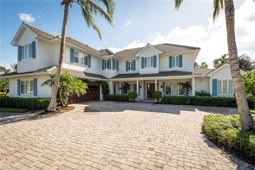 Enjoy gorgeous lake views from nearly every room of this two-story old Florida home in Old Naples nestled on a quiet street with wide water views of South Lake. This Four-bedrooms, four-and-a-half bath home features an office, great room which opens onto a large gourmet kitchen, spacious master bedroom with sitting room, a bonus room perfect for playroom or media room. The separate dining and living room make this house perfect for large gatherings.

Entertaining is a breeze with a spacious patio and covered lanai. This custom home by Frontier Homes has hurricane impact windows, doors and lots of custom cabinetry. No detail has been overlooked. Located only 3 blocks from the beach.