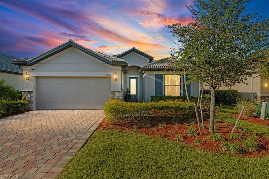 Step into this practically new luxury home in the prestigious River Hall Country Club, where elegance and modern comfort await from the moment you arrive. This beautifully designed residence offers three spacious bedrooms plus a versatile private den that easily converts to a fourth bedroom, two full bathrooms, and a convenient two car garage. The bright, open floor plan is perfect for effortless entertaining and everyday living, seamlessly connecting the chef's dream kitchen to the expansive living and dining areas. The kitchen impresses with two toned shaker cabinets, sleek quartz countertops, a stylish tile backsplash, and premium stainless steel appliances, while the adjacent dining room features a custom built dry bar complete with a wine cooler and mini fridge. The generous primary suite boasts a tray ceiling, an oversized walk in closet, and a luxurious ensuite bath with dual vanities and a spacious walk in shower. Guest bedrooms are thoughtfully placed on the opposite side of the home for maximum privacy, served by a full guest bathroom, and the flexible den provides an ideal office or study space. Step outside to an extended screened lanai that captures breathtaking lake views, enhanced by zero corner sliding doors that effortlessly blend indoor and outdoor living to include a new outdoor kitchen, and ample space to add your dream pool after closing. Thoughtful upgrades abound, including diagonal porcelain tile flooring throughout the main areas, upgraded carpeting in the bedrooms, a spacious laundry room with a laundry tub, a striking shiplap accent wall in the living room, pantry shelving, updated ceiling fans indoors and out, new lighting in the foyer, kitchen, and dining areas, a wood ceiling on the screened patio, plantation shutters throughout, motorized shades for the zero corner sliders, and epoxy flooring in the garage. Nestled within the gated, bundled golf community of River Hall, renowned for its 18 hole championship course designed by Davis Love III, this home delivers a true resort style lifestyle featuring a lagoon style resort pool, cabanas, the Bunker Tiki Bar, Caloosa Bar and Grill, two bocce courts, two tennis courts, four pickleball courts, a state of the art fitness center, fitness classes, and an on site activities director. Combining sophisticated design, premium features, and captivating water views, this exceptional three bedroom plus den residence offers the perfect blend of elegance, functionality, and unparalleled Florida living in a premier location.