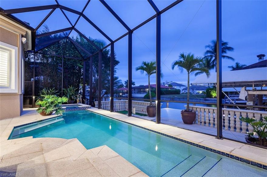 Breathtaking, coastal contemporary, Gulf-access retreat offered in North Naples’ coveted Conners/Vanderbilt Beach. This recently renovated residence is a beach & boater’s dream with a covered boat/jet ski lift, 20 ft boat dock, & ONLY A 5 MINUTE BIKE RIDE TO VANDERBILT BEACH! Relax & unwind in the heated pool/spa with sun shelf surrounded by a 49 ft terrace featuring an outdoor grill & shower. This immaculately maintained home is finely appointed with an open floor plan, BRAND NEW METAL ROOF INSTALLED IN 2022, BRAND-NEW 2022 HVAC & HOT WATER HEATER ON ORDER, electric storm shutters, NEW POOL PUMP IN 2021, oversized tile flooring, indoor electric fireplace & floor-to-ceiling sliding doors for seamless indoor/outdoor living. Gorgeous chef's kitchen features quartz countertops, professional grade cabinetry & Wolf/Jenn-air/Miele/GE appliances. Offers 4 bedrooms with a large master suite & guest suite located on the first floor! The spacious master includes a luxurious bathroom with a jetted freestanding tub, shower, & dual sinks. Conners is ideally located minutes to Mercato Shopping Plaza, Waterside Shops & convenient to 5th Ave downtown. Easy access to RSW International Airport.