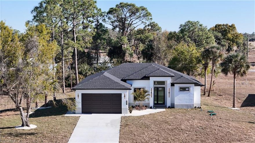 Brand new 2026 NEW CONSTRUCTION offering modern design, smart technology, and peaceful country living in LaBelle. Located on a quiet CUL-DE-SAC CORNER LOT, this home sits on an oversized 0.34-ACRE LOT with NO HOA and NOT IN A FLOOD ZONE — NO FLOOD INSURANCE REQUIRED.
The fully cleared and leveled property provides ROOM FOR BOATS, RVs, TRAILERS, AND TOYS, plus SPACE TO ADD A POOL while still enjoying a spacious backyard.
Enjoy true Florida outdoor living under the COVERED LANAI WITH A COMPLETE OUTDOOR KITCHEN & BUILT-IN GRILL, enhanced with FLUSH LED LIGHTING — perfect for entertaining year-round.
Inside, quality craftsmanship stands out with SOLID NATURAL WOOD CABINETRY (NO PARTICLE BOARD), GRANITE COUNTERTOPS THROUGHOUT, and BUILT-IN STORAGE IN EVERY CLOSET. The open-concept layout features TRAY CEILINGS, HIGH SPACIOUS CEILINGS, IMPACT WINDOWS, ELEGANT CHANDELIERS, and ABUNDANT NATURAL LIGHT.
The primary suite offers a spa-like retreat with a FLOATING DUAL VANITY WITH LED MIRRORS, SOAKING TUB, SEPARATE SHOWER, and CUSTOM BUILT-IN CLOSETS.
Designed as a FULLY INTEGRATED SMART HOME, enjoy SECURITY CAMERAS, OUTDOOR MOTION SENSORS, and SMART SWITCHES TO CONTROL LIGHTING & GARAGE FROM YOUR PHONE.
Ideally located minutes from downtown LaBelle with convenient access to Fort Myers, I-75, and Southwest Florida beaches — yet surrounded by quiet country views where you can relax and even watch cows grazing from your kitchen window.
BRAND NEW • MOVE-IN READY • SPACE • PRIVACY • TECHNOLOGY