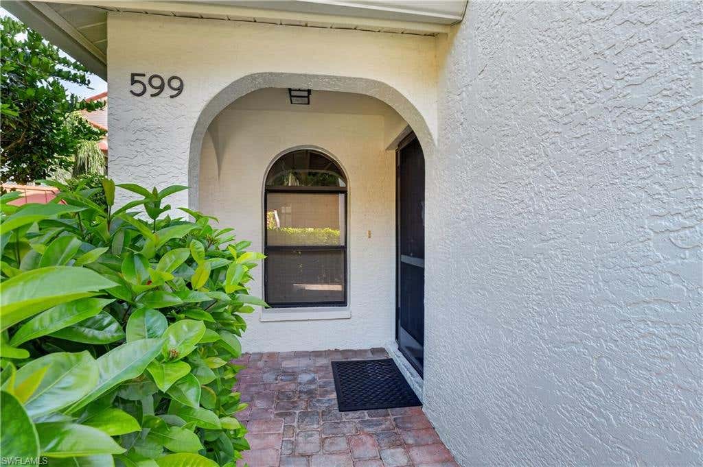 Photo of 599 Serendipity DR #599, NAPLES, FL 34108 (MLS # 226030023)