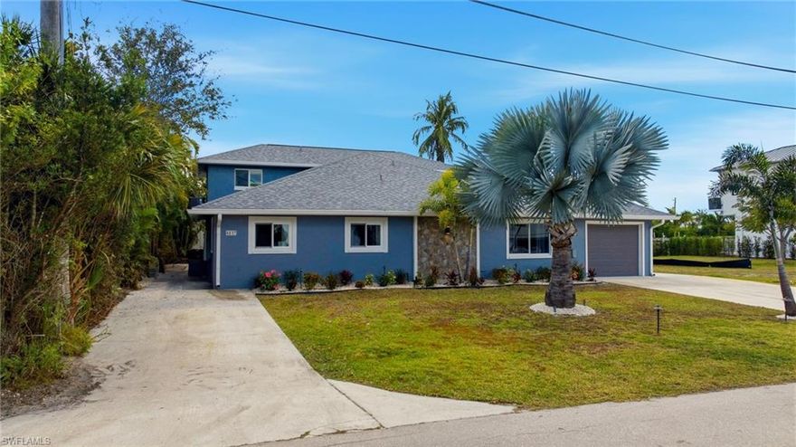 Experience the ultimate Southwest Florida lifestyle with this rare Gulf-access waterfront compound located just one mile from the sugar-sand shores of Bonita Beach. Perfectly positioned for boating enthusiasts and beach lovers alike, this versatile property offers direct water access to the Gulf alongside exceptional income potential, all with no HOA restrictions. Set along a wide 72-foot canal, the property features a private dock, 31’ x 4’ pier, and a 7,000-lb aluminum boat lift installed in 2021—making it effortless to head out for fishing, sunset cruises, or spontaneous days on the water. The main residence is a spacious two-story home designed for relaxed coastal living, featuring an open great-room layout where the kitchen, dining, and living areas flow seamlessly together with tranquil canal views. A large center island anchors the kitchen, complemented by quartz countertops and an inviting layout ideal for entertaining after a day at the beach or on the boat. Oversized glass sliders open to an enclosed Florida room, extending the living space outdoors and providing direct access to the backyard, dock, and water beyond. The first-floor primary suite offers convenience and privacy, while two generously sized upstairs bedrooms share a full bath, creating ample space for family and guests. An oversized attached one car garage with laundry area and extended driveway parking adds everyday practicality. Attached to the main home is a private one-bedroom guest residence with its own entrance and parking, offering excellent flexibility as a long-term rental, guest quarters, or multi-generational living space. Currently rented for $1,000 per month, the guest home includes an open living and kitchen area, a spacious bedroom, and an enclosed lanai that opens directly to the canal—allowing residents to enjoy the same waterfront lifestyle as the main home. Additional features enhance both comfort and peace of mind, including hurricane-impact windows throughout, updated PEX plumbing, a Culligan reverse osmosis drinking system, mini-split climate control in the lanai, and a large storage shed with metal roof. With quick access to the Gulf by boat and the beach just minutes away by car or bike, this property captures the essence of coastal Florida living—where mornings begin on the water, afternoons end at the beach, and evenings are spent enjoying breezes off the canal. Whether used as a primary residence with income, a waterfront retreat, or a long-term investment, this home delivers lifestyle, location, and lasting value. AGENTS SEE REMARKS