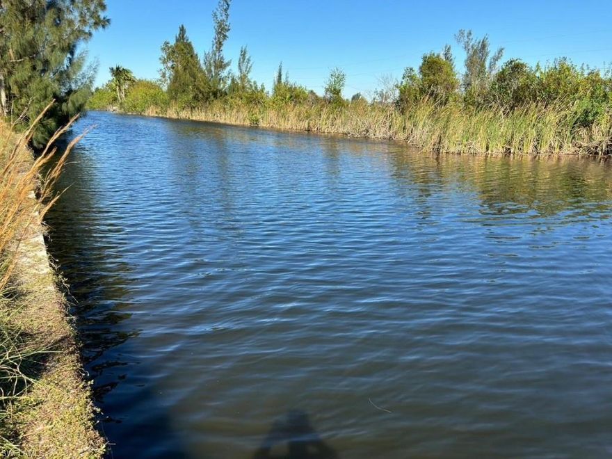 One or more photo(s) has been virtually staged, AI generated or rendered.  Exceptional opportunity in Cape Coral!
This 0.25-acre waterfront lot is fully permitted and ready for construction. All building permits have been approved, and the property already features a completed slab—saving time and development costs.

Enjoy direct water access with navigation to the Gulf, making it ideal for boating enthusiasts or a luxury waterfront residence.

Ready to build immediately. Motivated seller—bring your offers!