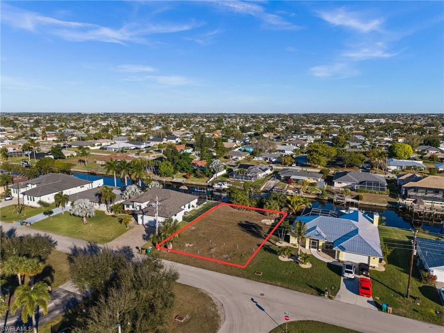GULF ACCESS LOT IN DESIRABLE PELICAN NEIGHBORHOOD! Build your dream home on this prime single-family Gulf access lot located at 241 SW 40th St in the Pelican neighborhood of Cape Coral. This well-established area is known for beautiful homes, quiet streets, and excellent access to boating, recreation, and everyday conveniences.

The property is on a Gulf Access Canal, making it ideal for boating, kayaking, and fishing right from your backyard. The lot is cleared, level, and ready to build. Water and Sewer are in, and all city assessments paid. A significant savings and a major advantage for buyers planning to build.

A standout feature of this location is the soccer field and park directly across the street, providing open views and easy access to outdoor recreation without sacrificing privacy. Whether you enjoy morning walks, youth sports, or green space at your doorstep, this setting offers a rare combination of waterfront living and neighborhood amenities.

Zoned single-family residential, with no HOA, this property offers flexibility for a primary residence, seasonal home, or future investment. Conveniently located near shopping, dining, schools, and everything SW Cape Coral has to offer, this is an excellent opportunity to secure a Gulf access lot in one of the city’s most desirable neighborhoods.

Don’t miss this chance to build your Florida waterfront lifestyle in Pelican.