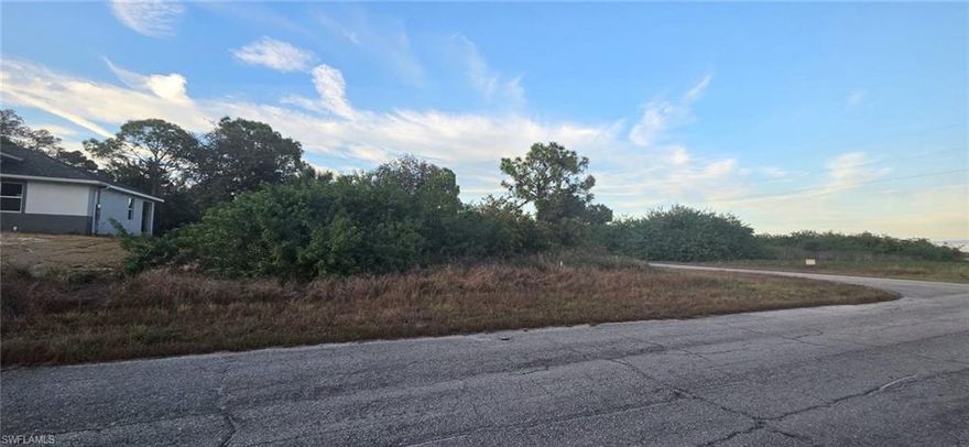 Great location of a 0.27 acres oversized residential corner lot in a peaceful LaBelle neighborhood, offering a spacious setting with natural surroundings, a stunning canal view, and a rear greenbelt for added privacy. Nestled on a quiet street with new construction homes, this parcel presents an excellent opportunity to build your future home or invest in a rapidly growing area. Located within Banyan Village, a developing community with high-speed fiber-optic internet, and providing convenient access to schools, shopping, and SR-80 while still offering a serene, rural atmosphere