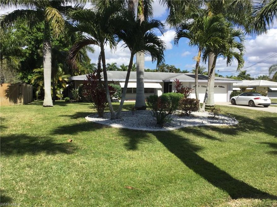 Location..Location..Location!    REDUCED $10,000.00. Value packed river views at this gorgeous yacht club location directly across from the river on royal palm tree lined street. Spacious solar heated pool home with generous sized bedrooms, 2.5 baths, formal living/dining plus family room. The kitchen has tiled backsplash, newer appliances and a large walk in pantry. Both full baths recently renovated with new tile and vanity. This is the perfect home to make into your HGTV dream home. You'll never find a better location !