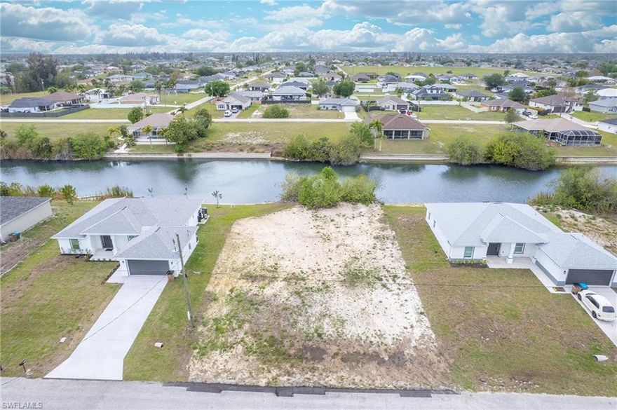 Waterfront lot available in the highly desirable northeast section of Cape Coral, offering a prime opportunity to build your dream home in a growing and convenient location. This homesite overlooks a wide freshwater canal, providing peaceful water views and access to interconnected canals perfect for kayaking, paddleboarding, and fishing.

The property has already been cleared, with only a tree and foliage remaining along the water’s edge, making it easy to begin planning and building your future residence.

Ideally located near shopping, dining, grocery stores, and the VA Hospital, this property offers both convenience and long-term value in one of Cape Coral’s expanding areas.

Whether you’re looking to build a primary residence, seasonal home, or investment property, this is an excellent opportunity to secure a waterfront lot in Cape Coral with strong potential and lifestyle appeal.