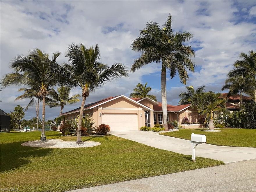 Updated gulf access home sits on the end of a wide canal for amazing water views! This home has an oversized covered lanai area that is perfect for entertaining. Lanai also includes a beautiful newly tiled outdoor shower. Open all 4 lanai pocket sliders and the screened in double front doors to get an amazing gulf breeze throughout the entire home. Beautiful mature landscaping that is nearly 0 maintenance! All neutral colors throughout home. Granite countertops in kitchen with stainless appliances. Both bathrooms have double sinks. Walk in closets in all 3 bedrooms. Vaulted ceilings in both living rooms and master. Fans in every single room including 2 on lanai. New carpet in bedrooms installed in 2020. New water heater in 2020. High efficiency central heating and air system installed in 2019. New energy efficient variable speed pool pump installed in 2019. Lanai screens replaced in 2018 along with new paint on pool cage and concrete floor. 10,000 boat lift. New paver steps installed in back yard in 2017. Heat blocking window tints installed in 2017.