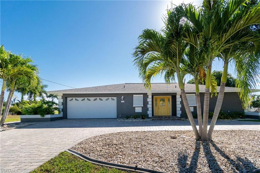 This is Palaco Grande living. One of Cape Corals premier boating communities welcomes you home. Direct river access from this beautifully landscaped home that has been completely remodeled in 2019 from ceiling to floor including a new roof in 2017. Custom cabinets and appliances as well as new 18" tile set diagonally throughout the home for a seamless flow that extends right on out to the lanai area. Great for entertaining family and friends. 2 master suites with huge closets and private bathrooms. Both of which have a separate private entrance to the pool area. Salt water and heated makes this pool a year round amenity to enjoy. The lush landscaping provides optimum privacy and shade around the lanai. Bring your Adirondack chairs down to the dock area and prepare yourself a cool drink because you'll want to hang around awhile. Too good to be true? Make an appointment and come see for yourself. Move in ready. Just bring your suitcase.