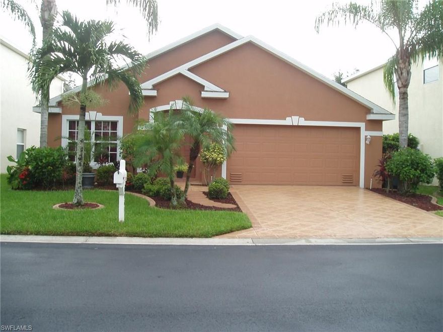 This home with cathedral ceilings was the builders most popular floorplan. It's design allows for a formal tiled living and dining room as well a more casual nook next to the kitchen and family room. The family room, located to the rear, provides great views and access to the caged pool area. The tiled kitchen has solid surface counter tops and stainless steel appliances. The Master bedroom and walk-in closet is carpeted with the remaining three bedrooms  recently laminated. The Master bedroom has entry into Bedroom 3 via a pocket door allowing it to be used also as a sitting room, office or a nursery. The spacious Master bath has a dual sinks marble vanity, a walk-in shower and a tub to relax in after a hard day.