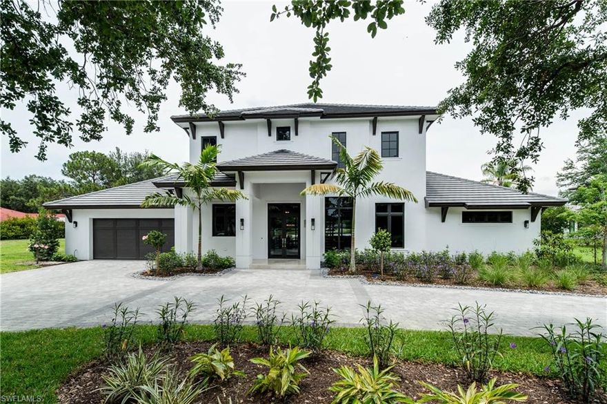 RG-Designs custom-built lakefront home with luxury upgrades and finishes - West Indies/Coastal style architecture with extensive indoor/outdoor living space and a beautiful custom pool/spa by Classic Pools of Naples. Chef’s kitchen displays Thermador stainless steel appliances; six burner gas range; Shaker-style wood cabinetry; pot-filler; island seating for six; Pompeii quartz island with granite countertops; and Carrera marble backsplash. Pompeii quartz countertops and frameless glass door showers are featured in the home’s six and a half baths; the master suite includes an over-sized walk-in shower with a multi-head shower system and stand-alone soaking tub. Other upgrades include custom closet systems, a fireplace with shellstone bricks, and engineered white oak flooring throughout. The outdoor living space includes a covered lanai with kitchen and granite counters; cypress tongue and groove ceiling; shellstone deck surrounding the pool with sun shelf and negative edge spa; gas fire pit; and fishing pier/kayak launch. The property also includes a storm shelter that has been converted into a children’s art studio with chalkboard painted walls and doors. See Attached Features.