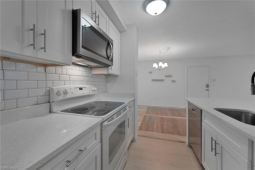 HIGHLY sought-after and RARELY available – COMPLETELY RENOVATED FIRST FLOOR UNIT in San Mirage! Centrally located, this unit features stainless appliances, quartz counter tops, shaker cabinets, freshly painted interior, tiled lanai, NEW AC (2023), European water fixtures, luxury vinyl flooring throughout, open concept layout, AND SO MUCH MORE! Light, bright and airy, this unit offers a private lanai just off living area to sit and relax while you enjoy your morning coffee or evening cocktail, ample counter space, and a stunning walk-in shower. Sunbath at poolside or enjoy the spa on those cooler winter days. San Mirage offers pristine grounds that rival the Botanical Gardens with a resort style swimming pool! Minutes to Downtown Bonita Springs, Barefoot Beach, Coconut Point Mall, shopping, grocery, AND RSW International Airport. If you are searching for your winter getaway OR for your permanent Florida home, this unit will NOT disappoint!