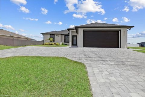 Photo of 809 Tropicana PKWY W, CAPE CORAL, FL 33993 (MLS # 225044176)