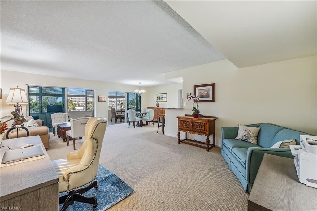 Photo of 3410 Gulf Shore BLVD N #305, NAPLES, FL 34103 (MLS # 225065682)
