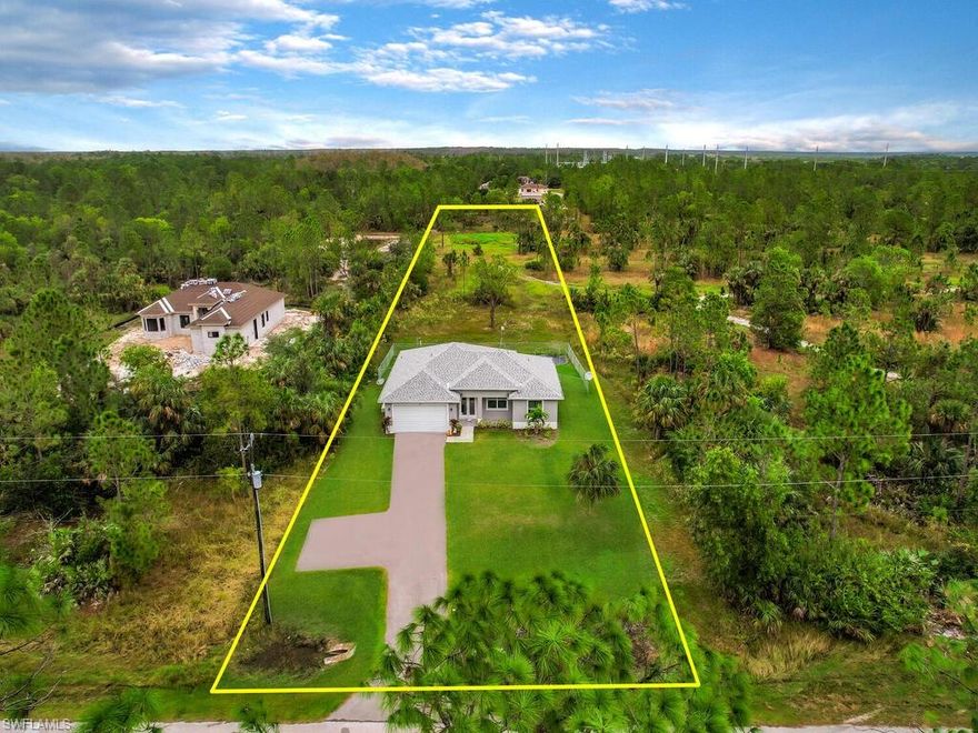 JUST BUILT IN 2021! Situated on over 1 acre of land, this single family home offers an open concept living layout & split bedroom floor plan. You will love the wonderful open feel of the home which features volume ceilings, French door front entry, kitchen w/ island & designer cabinets, large laundry room w/ storage, open rear lanai, fenced-in backyard, open front lanai, long driveway w/ additional parking pad, and attached 2 car garage w/ 220w outlet & epoxy flooring. A new high-end water filter system has just been installed. This property has plenty of room to add a detached garage/workshop, pool, rv/boat parking, & many other possibilities! Golden Gate is a popular area of Naples due to it's country feel and large parcels of land while only being a short drive from all the conveniences of life. PLUS, you will have easy access to I-75, Ave Maria, the beaches lining the Gulf coast, and public/private golf courses.