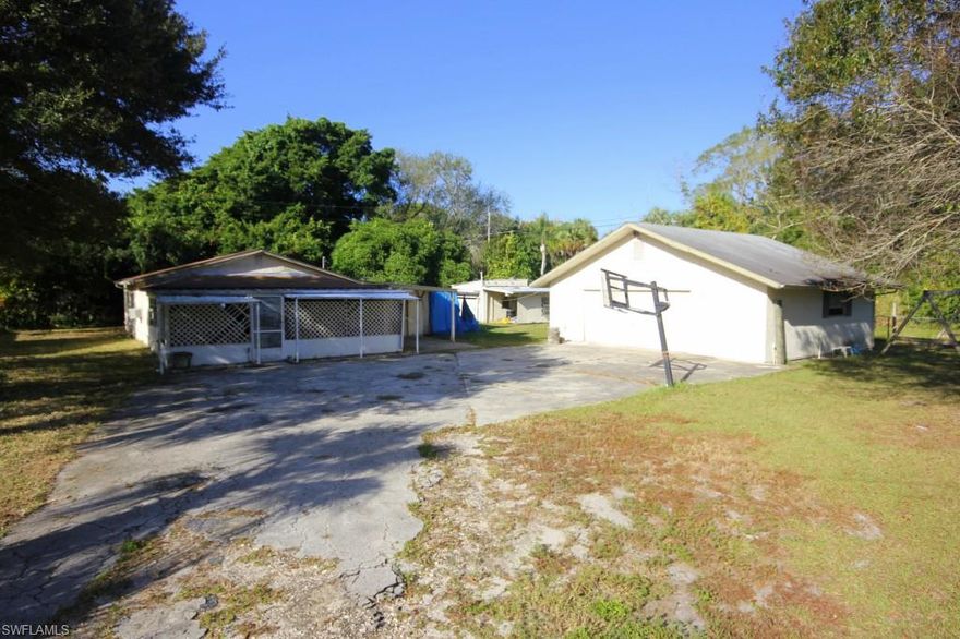 So much potential! This 3 bedroom home is located on an over-sized lot in the Russel Park area of Fort Myers. Features tons of storage with extra bonus rooms, 2 storage sheds and a massive over-sized 2 car detached garage for all your projects! Located right up the road from restaurants, shopping and quick access to I-75. Call today!