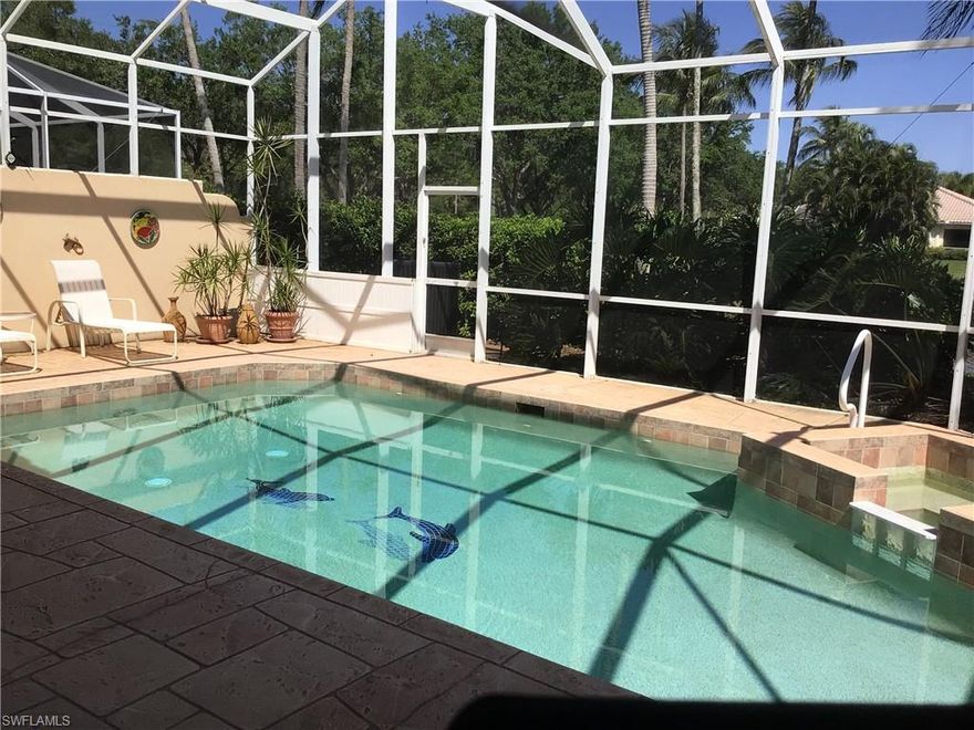 Immaculate Oakmont DiVosta home with heated pool and spa. Poured concrete construction with new tile roof. Huge screened lanai with large covered area and a lake view.  Tile throughout all rooms, completely renovated guest bathroom. Kitchen has granite counters and stainless steel appliances with pull-out shelving in the cupboards. Hurricane shutters on all windows and doors. Plantation shutters on interior windows. Built-in desk and shelves in den. Access to all Island Walk amazing recreation amenities including lap pool, resort pool, fitness center, tennis courts, social activities and much more.

REQUESTING HIGHEST AND BEST OFFERS BY 2PM MARCH 31, 2022