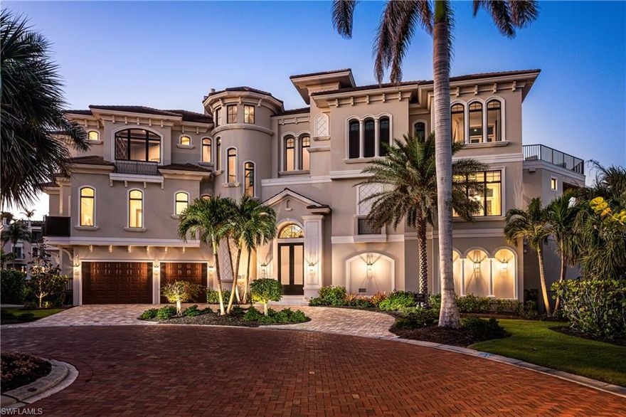 This 2019-Potter Homes built masterpiece is one of the most exceptional homes ever seen in Barefoot Beach. Positioned on one of the most coveted Bayside lots on a private peninsula in the exclusive, double-gated Southport on the Bay, this estate offers an unrivaled approximate 537* feet of wraparound water frontage, providing breathtaking Bay views on three sides and direct Gulf access. A more impressive panoramic waterfront view cannot be found. Crafted by the award-winning Potter Homes, this contemporary masterpiece is built like a fortress with all-concrete construction, hurricane impact windows and doors, and electric hurricane shutters. It is truly the ultimate retreat for beach lovers and boating enthusiasts, offering deeded beach access just a 10-minute walk away and direct Gulf access with no bridges from your 20,000 lb boat lift, along with a double jet ski platform lift. Every detail has been meticulously crafted, from the stunning oak flooring to the elegant coffered ceilings. The expansive floor plan spans 6,269 sq. ft. under air, featuring 6 bedrooms, a den, 6 full baths, 2 half baths, dual laundry rooms, a private elevator, a top-floor sundeck, a 3-car garage, and a versatile lower-level flex space. Step outside and experience one of the most extraordinary resort-style outdoor areas in the Barefoot Beach area. The outdoor space includes a large infinity-edge lap pool with a tanning shelf, water features, a swim-up bar, and a waterslide, all complemented by fire bowls and a fire pit—creating the ultimate space for entertaining. The outdoor patio features electric screens, a cozy fireplace, and a summer kitchen—perfect for al fresco dining and enjoying the serene surroundings. Inside, the chef’s kitchen boasts crisp white cabinetry, quartz countertops, high-end appliances, and multiple dining areas. The primary suite offers an unmatched retreat, complete with an attached office/den, wet bar, fireplace, and a private sundeck overlooking the bay. The spa-like bathroom features dual vanities, a large shower with a rainfall showerhead, and a separate soaking tub. Ascend the spiral staircase to the top-floor observation deck, where you can savor stunning sunsets and panoramic water views. Conveniently located near fine dining, RSW Airport, Mercato, and Waterside Shops, and just 15 miles from the renowned Fifth Avenue in Naples, this home is a true gem in the heart of Southport on the Bay.