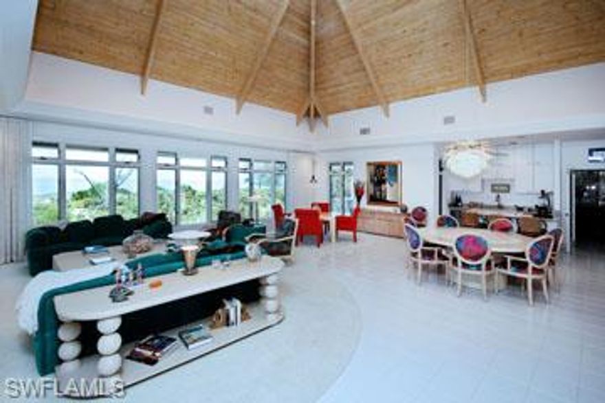 -Spectacular direct gulf front home on wide lot with 133 feet of white sandy beach. Breathe taking views. Built to the highest standards this impressive estate features 25 ft beamed ceilings with exposed tongue and groove construction. The main home has 2 kitchen, each with wine cooler, ice maker, oven & range. 2nd kitchen has 2 industrial quality commercial grills. Also has 2 great rooms,elevator, media center, surround sound, home office, and huge master suite with his & her bath & 2 walk in closets. The home is built in a Caribbean style around a raised concrete pool & spa with the 2 bedroom, 2 bath guest house adjacent to pool.