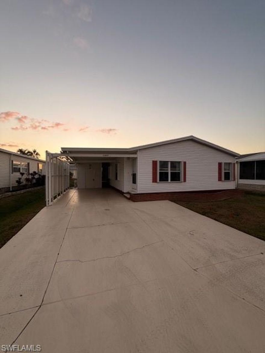 This newer 1993-built manufactured home in our 55-plus gated, manufactured-home community is nestled off the main traffic areas but close to Ft Myers and Sanibel Island beaches. This home's unique style showcases the split bedrooms, a large Den, and spacious kitchen. Over 1448 sq ft of living area and the additional Florida room allow you to relax in the air-conditioned lanai. For your safety, easy-to-close, hurricane shutters are on all windows. Enjoy more company with the extra-wide driveway. The residents are friendly and welcoming! The amenities include pickleball, tennis, bocce, shuffleboard, and an extra-large pool and hot tub. The two-story clubhouse creates an extraordinary experience to enjoy the library, exercise room, dining, stage, and dance floor to gather with your neighbors for many events throughout the season. Location is key, near restaurants, the hospital, shopping, and more.