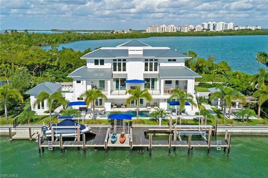 Incredibly rare opportunity/location! One of only three homesites with dock/direct gulf access in the exclusive, gated community of Hideaway Beach on Marco Island. This exceptional 2020-built estate sits on one-and-a-half lots and enjoys 160' of water frontage with beautiful views of the waterway and Collier Bay. The entire property perfectly blends coastal-contemporary luxury with the elegant and understated island lifestyle. Clearly among the island's most impressive properties built with over 5,300 square feet of impeccably designed living spaces oriented to take full advantage of the surroundings, natural light and beautiful views. Offering four bedrooms, four-and-a-half-baths, office, lower-level game room, bar and exercise room. Nearly every room opens up to the amazing outdoor living spaces, expansive, open lanai with pool/spa, pergola with fire pit, detached workshop and plenty of room at the dock for all your water toys. Additional amenities include an elevator, generator, propane tank, Control4 home automation and more. Hideaway Beach offers over 2 miles of beach, gorgeous formal/informal dining facilities, community pool/spa, tennis, 9-hole golf, sports center and more.