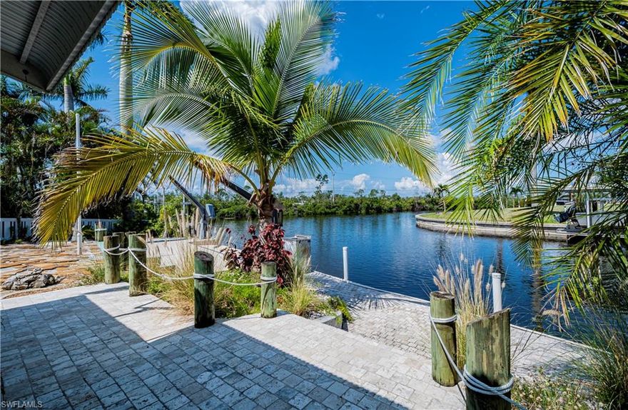 DIRECT GULF ACCESS!!! Located on an oversized cul-de-sac lot with approximately 104 feet of seawall, this beach-themed home offers amazing views of the water. Enjoy the breathtaking sunsets from your private backyard. It includes a boat lift, davits, and a fish cleaning station - ideal for fishing enthusiasts and water lovers. Tile flooring throughout ensures easy maintenance, while the enclosed sunroom offers a serene space to relax year-round. Perfect as a primary residence or a vacation rental.  New roof and water heater in 2018. Quick access to Matlacha Pass. Located in the small neighborhood of Matlacha Isles with easy access to many restaurants and shopping.