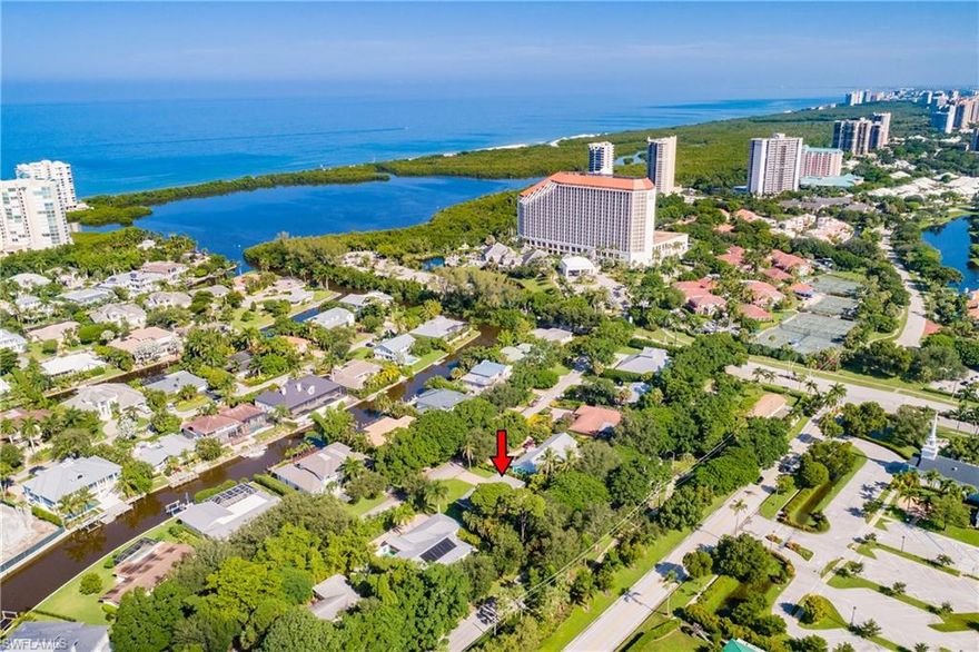 Best of both worlds! Private Paradise only 4 HOMES FROM BEACH ACCESS! 
Situated in the exclusive community of Seagate, this one of a kind, Eclectic home has a large fenced private backyard w/mature landscaping, (including avocado, mango, and starfruit), that feels like you’re in your own forest right near the beach. Home has soaring cypress wood beam ceilings and solid wood flooring in the main living areas. A huge family room opens to kitchen w/large pantry. Walk out of your Mstr BD French doors onto a Jasmine filled deck w/private outdoor shower and spa. Also includes your own private beach park for a nominal fee. Walking/biking distance to 3 beach accesses, Waterside Shops and restaurants, Seagate Elementary, or take the tram to Clam Pass Beach Park for a sunset cocktail at the beach. No mandatory associations. Underground electric-no poles or wires on property. A true city of Naples Gem!! Being sold in as is condition.