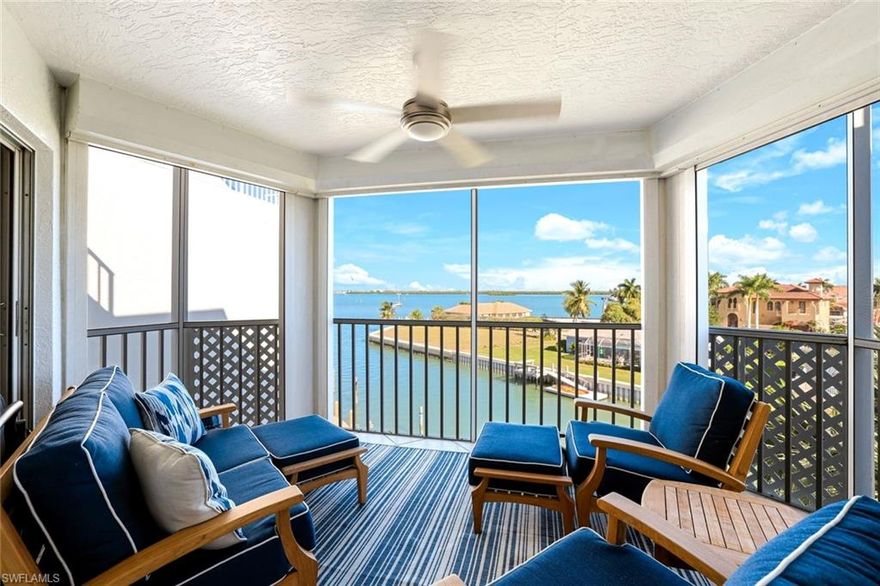 Stunning, fully remodeled end-unit with sweeping, panoramic Marco River views. This exceptional residence at Grand Bay combines modern luxury with an unbeatable waterfront lifestyle. Park your boat on the lift (10k lb) right outside and enjoy quick access for fishing, cruising to local waterfront restaurants or to a serene beach to relax for the day.   Featuring a bright, open floor plan filled with natural light, this beautifully updated condo offers a contemporary coastal feel from the moment you step inside. The impressive kitchen is designed for both style and functionality, showcasing a large island, quartz countertops, stainless-steel appliances, a wine cooler, and a pantry with pull-out drawers. The spacious primary suite serves as a private retreat, complete with a custom walk-in closet, a walk-in shower, and a double vanity. New impact windows recently installed and electric shutter on the lanai for peace of mind.   The large tile flooring throughout gives this residence a clean, modern aesthetic feel. Perfectly located close to Dolphin Tiki and The Burrow, Grand Bay enhances your coastal lifestyle with amenities including a community pool, kayak storage and launch, and both tennis and pickleball courts. The property also offers direct boating access and is pet-friendly, making it ideal for active island living. Modern, bright, and move-in ready, this residence delivers the best of Marco Island’s waterfront lifestyle with top-tier upgrades and community features.