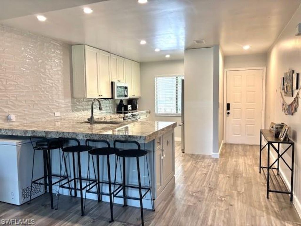 Photo of 5656 Woodmere Lake CIR #C204, NAPLES, FL 34112 (MLS # 225083400)