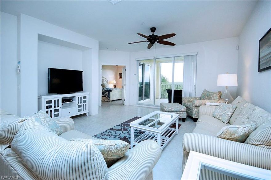 Private Gated Community with a 5 acre lake located on 20 acres. Nice open flow to the floor plan with 2 split bedrooms and baths. Master bedroom has a walk in closet and glamour bath with shower and double sinks. Covered lanai is accessible from the living and master bedroom. Breakfast nook off the kitchen with a pantry and lots of counter/cupboard space. Private 2 car garage under building and access to the unit from a common elevator. Beautiful tropical landscaping surrounding the amenities of clubhouse, pool, tennis courts, gated, fitness and full elevator accessibility. Close to walking or biking to Bunche Beach, shopping within walking distance and Sanibel/Captiva and Fort Myers Beach. Beautiful Community, Wonderful Lifestyle.