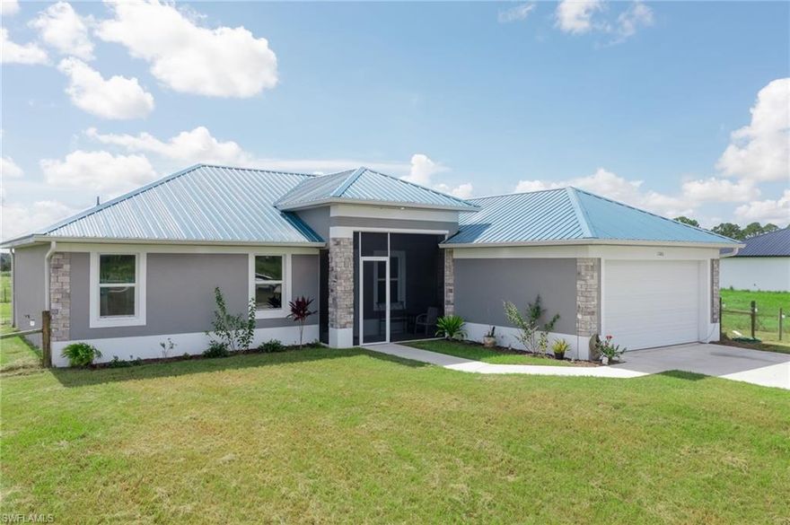 This one-year-old home offers the perfect blend of comfort, convenience, and a touch of Florida living. Step inside to find a spacious, open-concept living area. The well-lit interior features abundant natural light, highlighting the neutral color palette and high ceilings. The kitchen is equipped with modern appliances, plenty of counter space, and an adjacent dining area. It's a functional space and perfect for entertaining. The house boasts 4 comfortable bedrooms that offer a peaceful retreat for rest and relaxation. The master suite features an ensuite bathroom and ample storage. Tile throughout the home provides low-maintenance flooring for kids and pets. A spacious 2-car garage offers protection for your vehicles and additional storage space. Enjoy your morning coffee on the screened back porch while soaking in the Florida sunshine. An oversized and fenced lot allows plenty of room to build a backyard oasis or lounge in the pool. If you've been dreaming of a charming single-story home in LaBelle, Florida, this property is a must-see. Don't miss the opportunity to make it your own and enjoy the serenity and beauty of this wonderful community. More info here: bit.ly/1260wren