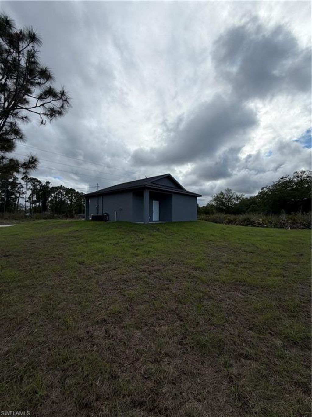 Photo of 404 W 17th ST, LEHIGH ACRES, FL 33972 (MLS # 226015962)