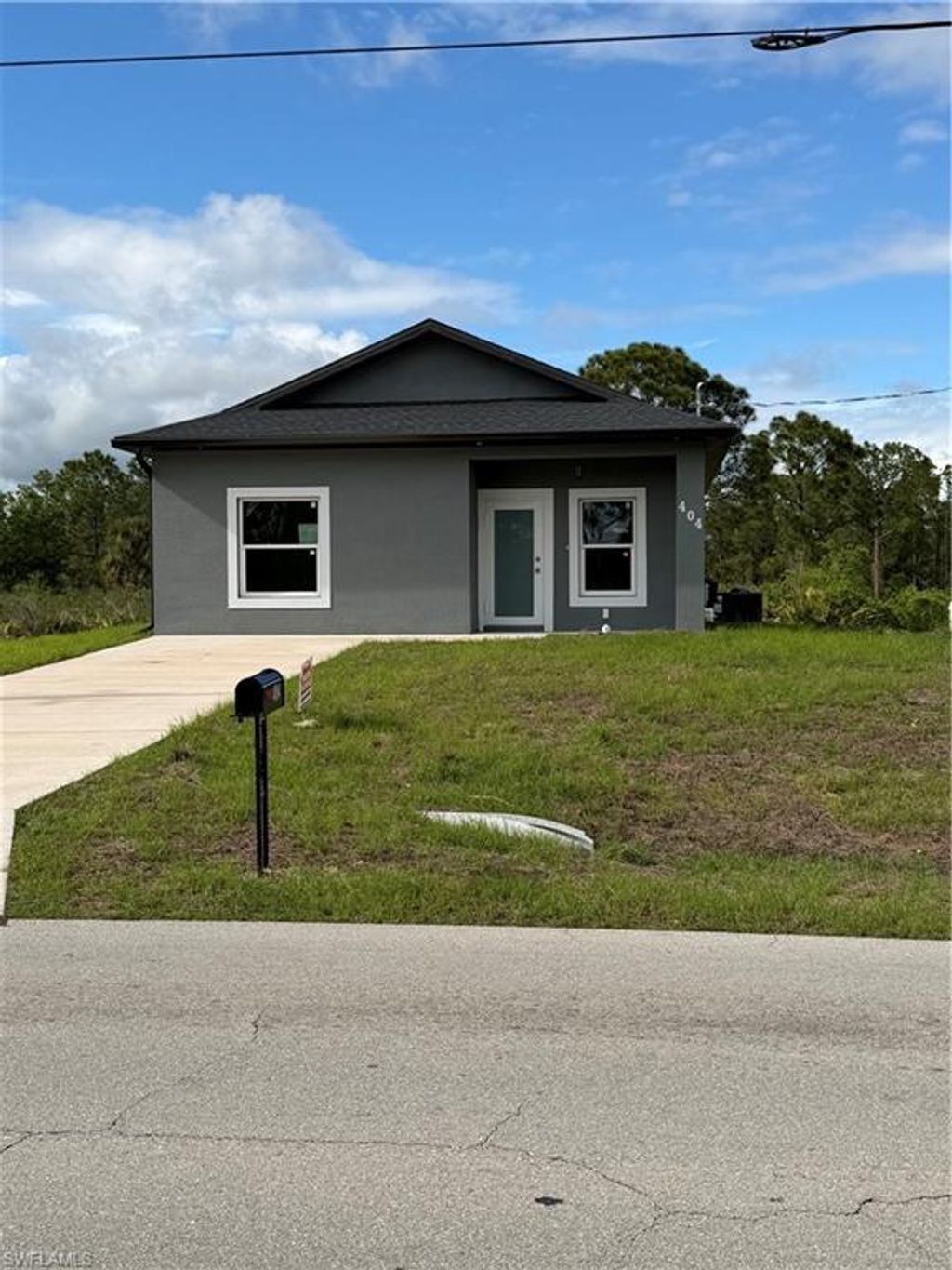 Photo of 404 W 17th ST, LEHIGH ACRES, FL 33972 (MLS # 226015962)