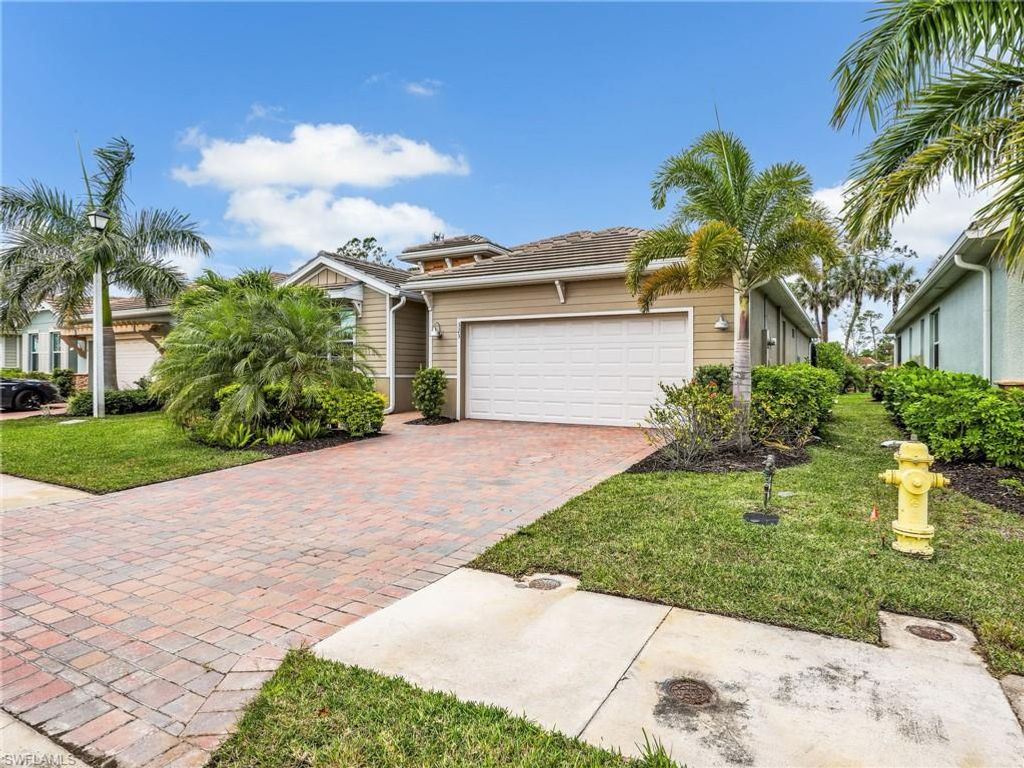 Photo of 323 Tamarindo LN, NAPLES, FL 34114 (MLS # 226015462)