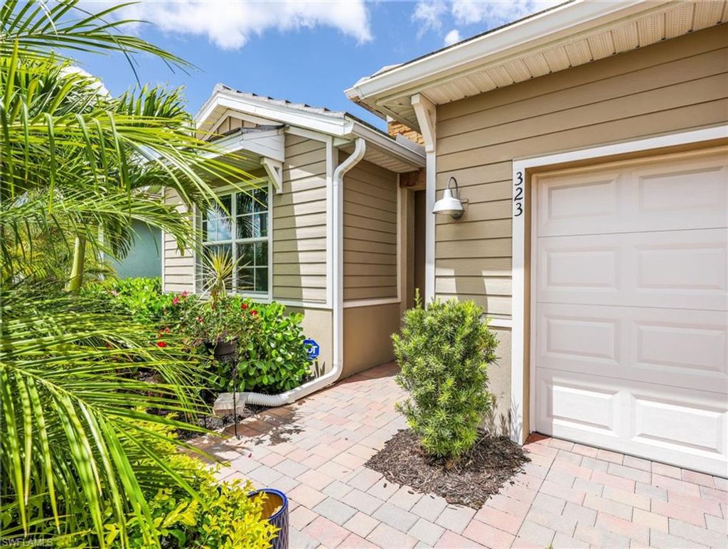 Photo of 323 Tamarindo LN, NAPLES, FL 34114 (MLS # 226015462)