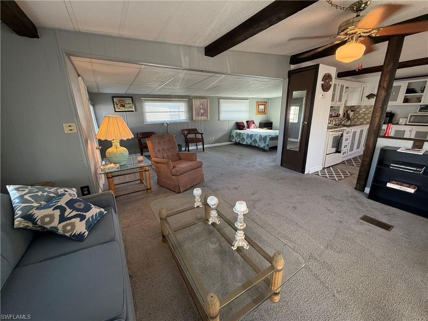 Are you looking for an ALL-age community with no pet restrictions?  This charming 2-bedroom/1 bath with enclosed Florida sunroom awaits a new owner ready to breathe life and love into its walls.  Lots of windows allow that beautiful Florida sun to naturally lighten and welcome the day. Kitchen comes fully stocked with all appliances including fridge, oven/range, and microwave. Additional appliances include washer & dryer set located in the oversized shed. Community is not requiring new owner to replace the carport. No grey piping and updated electrical along with newer vapor barrier, subfloors, and floors.  HOA fees are just $100 a year.