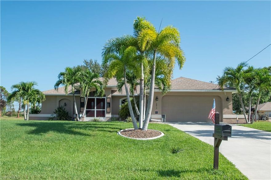 Gorgeous 4 bedroom, two bathroom home in a quiet neighborhood in the Burnt Store Area.   This home is the pride of ownership and you enter the home through the screened double doors.  The home has beautiful 18 in tile throughout and a grand entryway.   The family room is large and flows into the kitchen with its own island, stainless steel appliances and solid surface countertops.   This area is ideal for a family to relax and be together after a day of work or school.   The home has 4 bedrooms and one could be used as an office or a true 4th bedroom.    The family-livingroom-kitchen leads to two disappearing sliding glass doors into an oasis backyard that has an extended screen in lanai with a paver deck,  fire pit and Jacuzzi jetted hot tub which comes with the home.   The home has lush landscaping, mature palm trees, granite rock in the flower beds and a gated 6 foot privacy fence. The master suite is large with volume ceilings, a walk in closet and a private bathroom.  The en suite bathroom has a walk in shower, his and her sinks with a garden tub. The two other spare bedrooms are off on the other side of the home and have a second bathroom with shower/ tub.  Great location