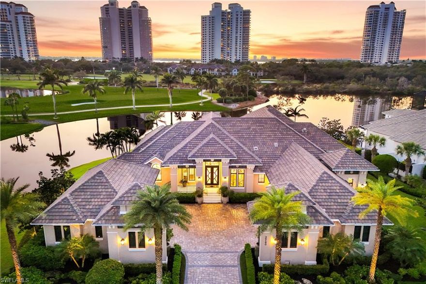 Nestled in the serene embrace of Bonita Springs, this masterfully designed Stock Custom Home is in the coveted BayWoods II of Bonita Bay invites you into a world where luxury and nature exist in effortless harmony. Perfectly positioned on an oversized lot, the residence is surrounded by sweeping lake and long golf course views, capturing the most picturesque western sunsets—golden hues that spill through every window and illuminate every thoughtfully crafted detail.

As you step inside, an abundance of natural light pours through expansive windows, giving the open floor plan an airy, elevated feel. Elements of painted tongue-and-groove bring dramatic dimension to the ceilings, while a custom mirror set into the dining room’s built-in niche enhances the home’s timeless coastal aesthetic. A sophisticated blend of clean, modern surfaces and rustic accents—weathered woods, mixed metals, unique custom cabinetry, and artful touches— were meticulously curated to create a visual symphony of livable luxury. The color palette is equally inviting, featuring layered taupes, crisp whites, cool greys, and warm caramel accents.

For the culinary enthusiast, the gourmet kitchen is a dream come true, equipped with Sub-Zero and Wolf appliances, including a sleek gas cooktop that inspires endless culinary creativity. Yet the heart of this home extends beyond its walls. The expansive, fenced outdoor living space is a private resort unto itself—a sanctuary perfect for both grand entertaining and quiet unwinding. Here, you’ll find a fully appointed summer kitchen, a cozy outdoor fireplace, and striking fire features that reflect across the custom salt-water pool and spa. Multiple conversation areas invite gatherings of every kind, all set against the backdrop of postcard-worthy water and fairway vistas.

Car collectors will delight in the six-car garage, complete with water, charging stations, and storage wings—designed for the most discerning enthusiast who values space, utility, and refinement.

Beyond the property, Bonita Bay elevates the lifestyle even further. This extraordinary community is more than an address—it is a destination thoughtfully designed to balance luxury living with the beauty of Southwest Florida’s natural environment. Residents enjoy a private beach park with pristine sands, three waterfront recreational parks, and 12 miles of scenic tropical trails ideal for biking, jogging, kayaking, and canoeing. Dine at the renowned Back Water Jacks, or explore optional memberships offering access to the prestigious Bonita Bay Club, 5 championship golf courses, 15 pickleball courts, a state-of-the-art fitness center, social programs, and the full-service marina.

This exceptional residence is more than a home; it is a lifestyle—one of tranquility, sophistication, and unrivaled coastal charm.