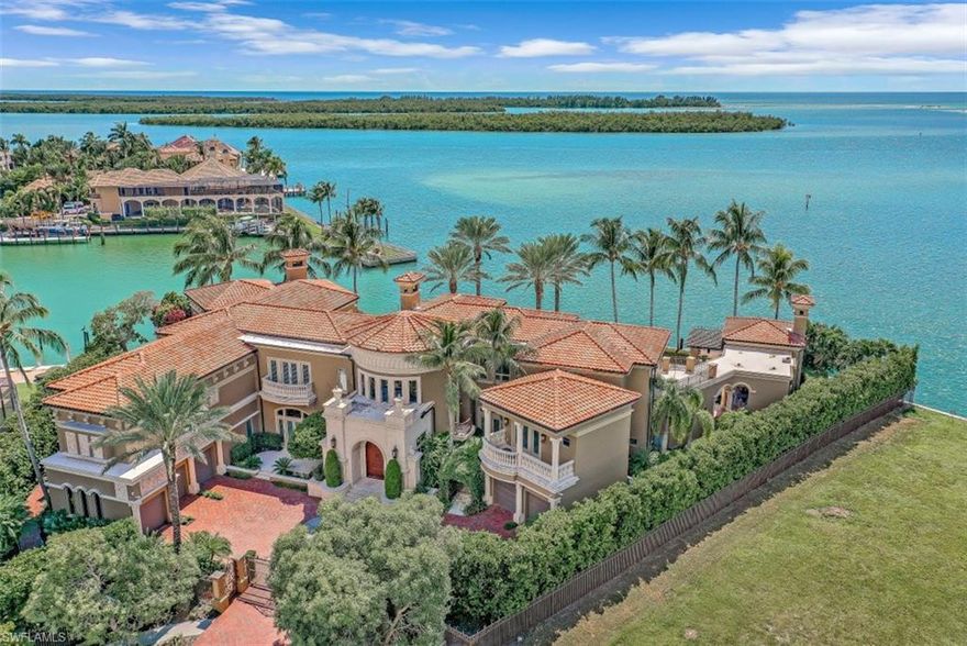 1549 Heights Court is intimate and generous in scale, with impeccable design in an exceptional setting. Commanding sweeping, unobstructed Southwest vistas of the sandbars of Caxambas and the open water of the Gulf of Mexico beyond, and a 260 lineal foot Teakwood wrap-around dock provide the ultimate in Florida luxury yachting life. Gated entry with 5 split garages and a 3-story, hand-painted 33ft. cupola entrance welcome you to an expansive, five-bedrooms, six-bathrooms, with 4 coquina shell stone fireplaces and 6 balconies of over 7300sf of multi-tier lanais. A formal Mahogany Den overlooks the 75ft olympic pool and spa. Formal dining room leads to an Open family great room, dine-in kitchen with 3 center islands, double Viking ranges and sub-zero fridge. Enjoy a games room with billiards and pub bar. Double primary suites, 1 accessible for independent living and the 2nd primary with bath/sauna/private patio, sweeping view lanai, fitness room, his and hers custom closet, home office, 10-seat theater with wet bar. Split bedrooms with shared living/media room, mid-level guest suite with private garage access. Expansive outdoor kitchen, dining, living oasis of European elegance.