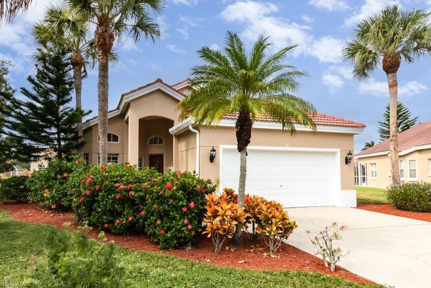 NEW TO MARKET! Located on an oversized cul-de-sac lot with stunning lake views, this home has been freshly painted inside and out including new entry and carriage lights welcoming you home.  A newly installed A/C, new microwave, and garbage disposal, await you.  Additionally, you will enjoy new neutral colored tile in the entry foyer, kitchen and baths with new bedroom carpeting.  The kitchen and bathroom faucets are also new.  Sabal Lake's location offers quick access to nearby grocery stores, banking, and dining along with short drive to downtown Naples, the beaches, Paradise Coast Sports Complex and I75.