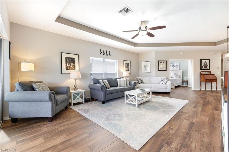 With picturesque golf course views as its backdrop, this modern condo retreat in the renowned Quail Creek Village community offers a relaxed, elevated way of living. The spacious great room floorplan is filled with natural light and features a desirable split bedroom design, complemented by stylish wood look tile flooring throughout. For home chefs, the kitchen is thoughtfully arranged with generous cabinet space, stainless steel appliances, and an open layout making it easy to entertain and enjoy the scenic golf views. Enjoy your tranquil owner's suite complete with an updated bathroom and sizable walk in closet. Outside on the screened lanai, relax with morning coffee, al fresco dinners, or open the sliding glass doors to welcome fresh air in. An oversized one car garage provides exceptional storage and boasts all new Epoxy flooring and custom built in cabinetry. Electric Storm Smart screens installed in 2023 and a full repipe in 2021 are also terrific added values for the new owner. Included with this condo is an Equity Social Membership to the Quail Village Golf Club granting access to the newly renovated clubhouse, unlimited summer golf, six rounds in season, tennis, bocce, pickleball, and the poolside pub Bogeys. Full Golf Memberships are available with no initiation fee for residents or waitlist. Whether you've been seeking a seasonal retreat, golf community, or simply a slice of Naples paradise, your exceptional residence awaits!