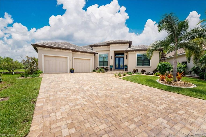 I'm out of adjectives to describe this home.
This one has it all...Nearly new (built 2019)This property is located less than 20 minutes to open water with no bridges. This home is on lot with 180’ of seawall and a 160’ dock / water & electricity. FURNITURE AND FURNISHINGS INCLUDED*. You will be impressed with the great room & panoramic pool/ water views. From porcelain tile floors to ceilings quality of workmanship abounds. The kitchen has Quartzite Countertops, SS appliances, and solid wood cabinets, oversized refrigerator and freezer, two-drawer under counter dishwashers, and  induction cooktop. Note the walk-in pantry. The master suite has a spectacular view of the pool.   
The master bath has 2 vanities, walk-in shower, granite countertops, &2 water closets.The junior master suite, also with a pool view, is no less luxurious / private bath.  The third bedroom has the third full bath immediately adjacent. The office/den at the front of the house is bright & airy. The expansive lanai has stained tongue&groove ceilings. The saltwater pool has a glass bead Pebble Tec finish is heated/ solar& heat pump.  . The garage/ epoxy floor is oversized & high ceilings a lift.