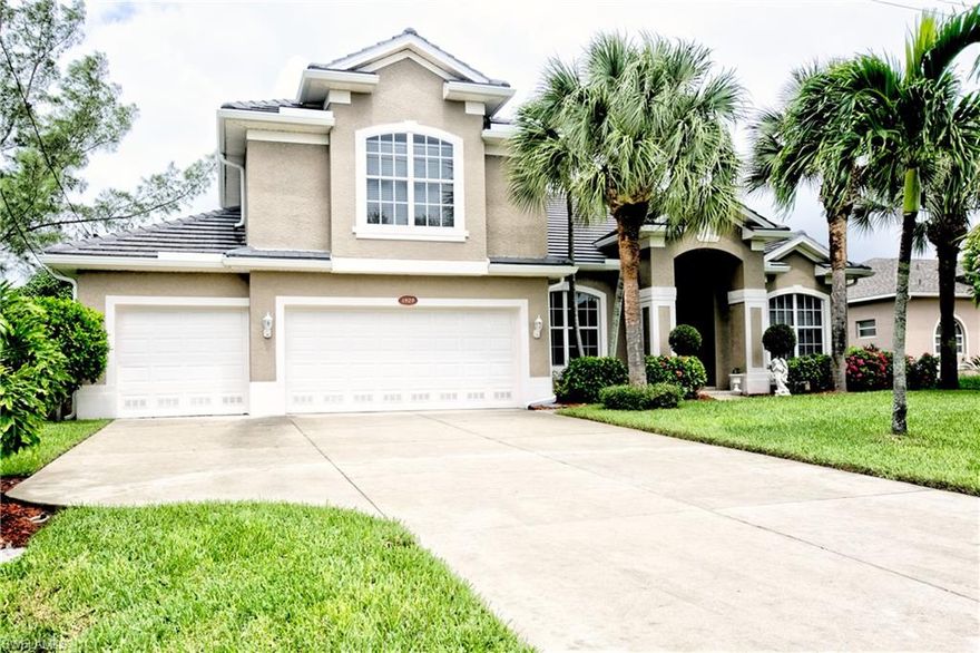 GULF ACCESS POOL HOME in in the highly desirable Unit 69 near Cape Harbour. This home has plenty of room for the family with 4 bedrooms plus a bonus room. The 4th bedroom could be used as den. Large three car garage, pool and a bonus room upstairs. This is a boaters dream with large intersecting canals, dock and boat lift. New roof 2019. New Kitchen and floors throughout. 2 newer AC units, rescreened pool cage and much more. This home even has a safe room in case of a storm or to secure valuables. This home is a must see. Bonus to the Buyer: Seller will Pay off Balance of Assessments at closing!