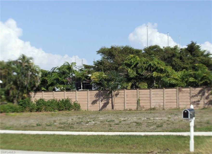 Central, conveniently located inland lot close to the center of Marco Island and a very short distance to Mackle Park, YMCA, the Raquet Club, Historical Society, library, elementary school and anything else you might need. In an area of lovely waterfront homes, with newer built home right next door. A short drive brings you to Resident's Beach or South Beach. Nice privacy fence and hedge along the back. Eastern exposure for morning sunlight and sunsets out your front door. Don't miss this great opportunity for an affordable building lot on Marco Island.  Cleared and ready to build now or down the road when you are ready.