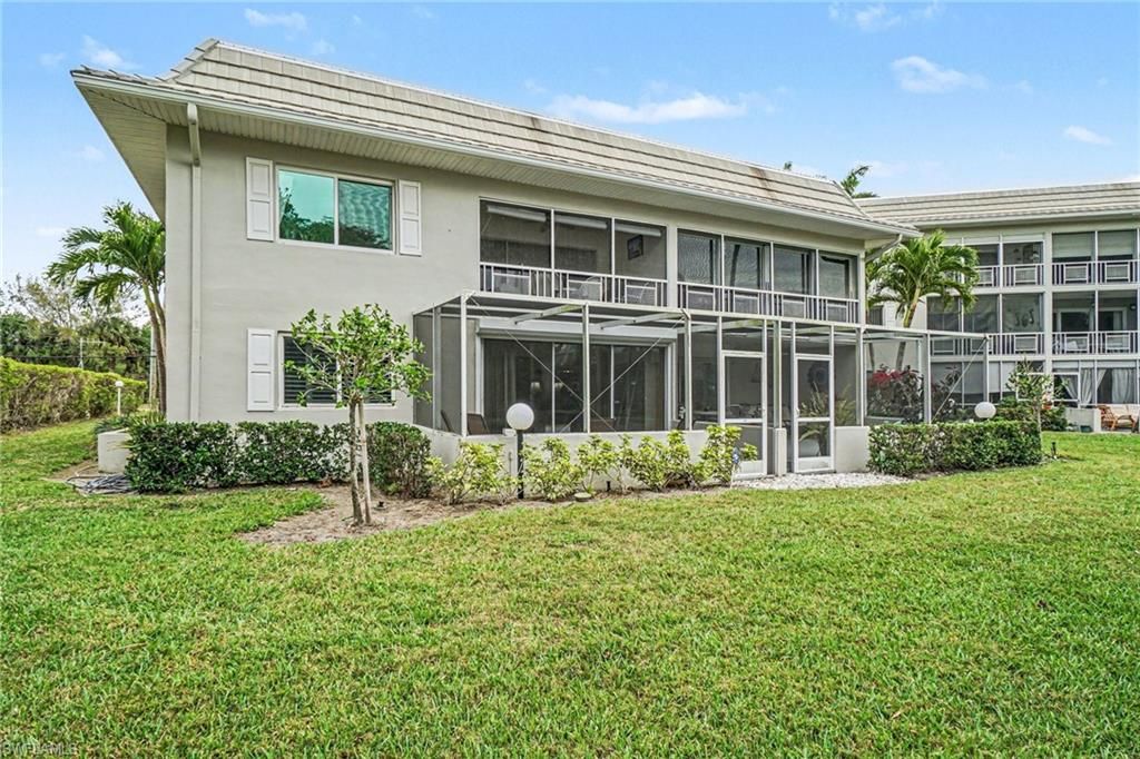 Photo of 215 Cypress WAY E #E2, NAPLES, FL 34110 (MLS # 226011602)