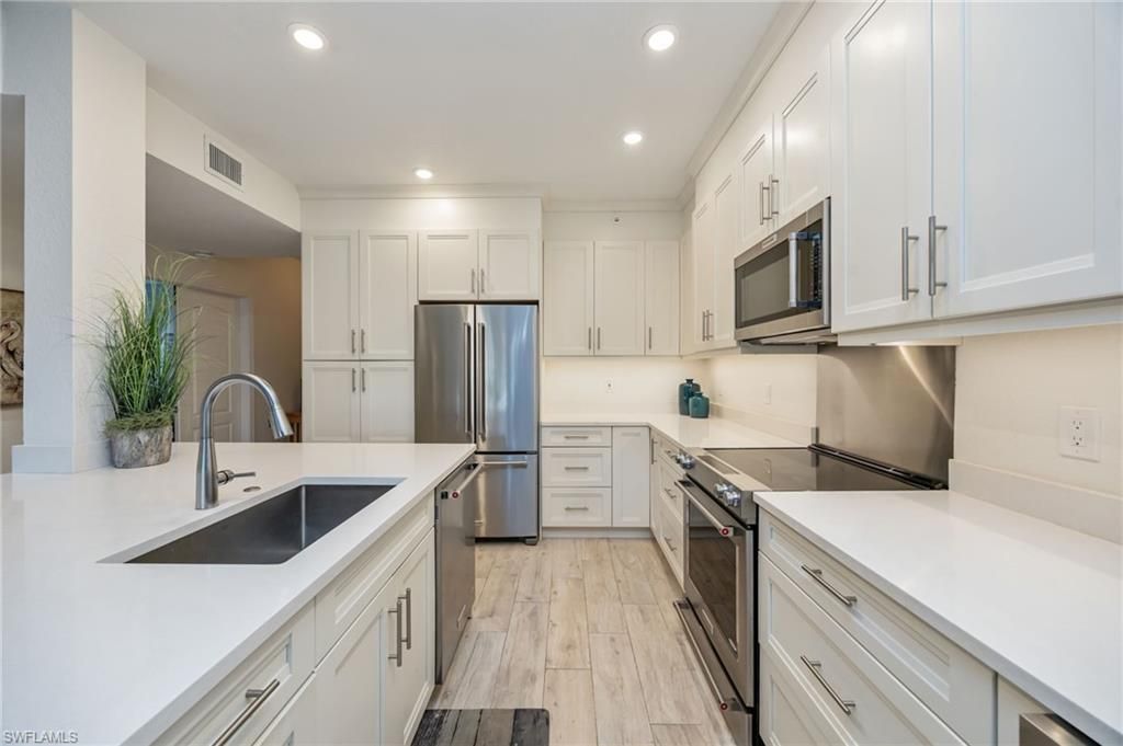 Photo of 7686 Pebble Creek CIR #102, NAPLES, FL 34108 (MLS # 226003035)