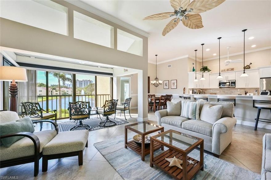 Great opportunity to own this 3 bedroom, 2 bath recently remodeled & completely updated 2 floor condo within walking distance to Vanderbilt Beach! The kitchen is appointed with white shaker cabinets, quartz counter tops, marble backsplash, breakfast counter & stainless-steel appliances. The spacious great room has vaulted ceilings, long lake views & enclosed lanai adding-130 sq. feef under air. The remodeled bathrooms have raised white panel cabinets, quartz counter tops & walk in showers with glass enclosures. The split floor plan provides privacy between master suite & guest bedrooms, master suite closet organizer, two panel interior shaker doors with brushed nickel hardware and tile flooring throughout, PGT hurricane impact windows, motorized hurricane shutters for lanai sliders and decorative white plantation shutters. Front patio tile was installed with non-slip porcelain tile, the Trane HVAC and all other appliances approx. 3 years young, & attic storage is available with retractable stains. Polybutylene pipes have been replaced with copper.  Beachwalk amenities include: 24 hour manned gate, 2 community pools/spa, 6 lighted Har-Tru tennis courts, clubhouse with fitness room.