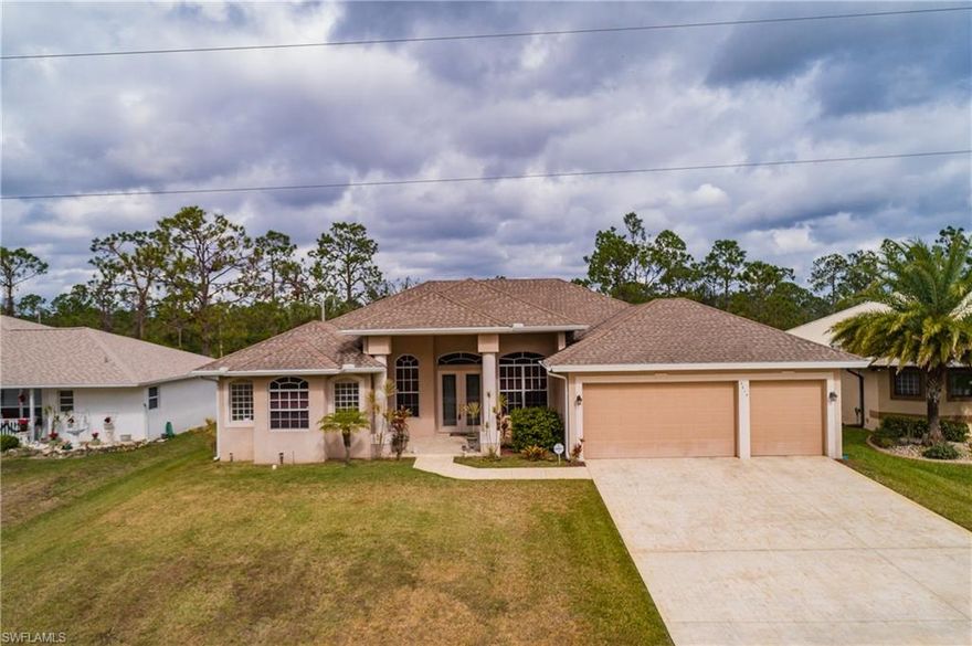 **** Motivated Seller ********* Bring all offers**** Clients are Motivated************
Don’t miss the opportunity to see this Gorgeous 3 bedroom + den, 3 bathroom pool home in one of the most desirable neighborhoods in Lehigh Acres!  This home offers great curb appeal with a double door entry with decorative glass, arched windows & lovely landscaping!  You enter into a welcoming open floor plan with beautiful tray ceilings, a formal living & dining area & sliding glass doors that open to a fantastic view of the pool.  The kitchen is the heart of the home with granite countertops, stainless steel appliances, a large breakfast bar, a cozy breakfast nook & plenty of cabinetry.  The private master suite features his & her closets & an en suite bathroom with dual sinks, a tiled shower & jetted soaker tub for relaxing!  The large lanai is great for entertaining with a sparkling pool with a tranquil waterfall.  You will also have the security of a home warranty with your purchase.  Call today for a personal tour!