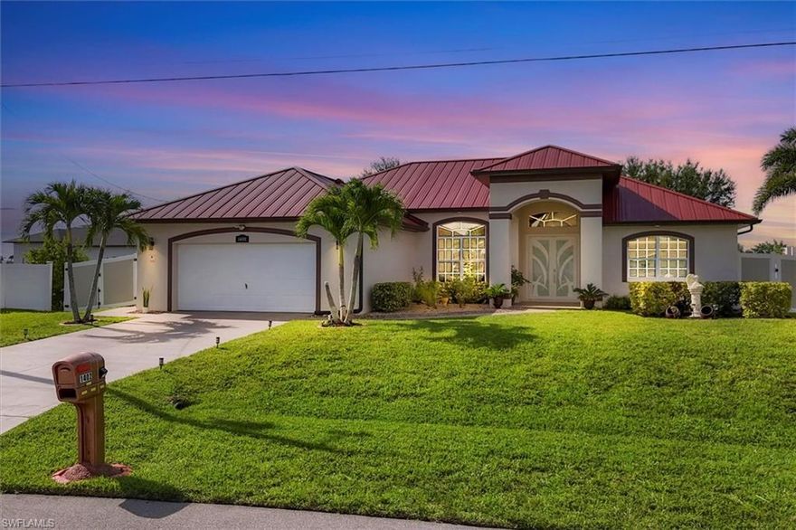 Florida Living at Its Best – Canal-Front Pool Home in SW Cape Coral!

Welcome to your dream home in a peaceful SW Cape Coral neighborhood—not in a flood zone! This beautifully maintained canal-front property is surrounded by lush landscaping, tall palms, and a custom vinyl fence, giving you privacy and serious curb appeal.

Inside, enjoy tile flooring throughout, 3 spacious bedrooms, 2 bathrooms, a den/office, and a bright open living/dining area with soaring ceilings and triple sliding doors leading to the screened pool. The updated kitchen features a raised granite breakfast bar, new refrigerator (2025), and a sunny breakfast nook/dinning room area with views of the pool and canal—perfect for laid-back mornings.

The primary suite has private lanai access and a spa-like bath with dual granite vanities, a walk-in rain shower, separate toilet room, and a generous walk-in closet. Guest bedrooms are tucked on the opposite side of the home for added privacy. The second bath includes a full tub, updated hardware, and newer toilet.

The laundry room is fully equipped with newer washer/dryer, a utility sink, and storage closet. The 2-car garage has two storage closets and a sleek epoxy floor.

Step outside to your tropical retreat, enjoying the green lawn all year around, an automatic irrigation system in place, a screened pool, freshly painted lanai floor, and peaceful water views framed by Royal Palms. It's the perfect place to relax or entertain.

Major updates include:

·         2025: Refrigerator

·         2024: Impact front door

·         2023: Metal roof, custom vinyl fence, pool heater

·         2022: Water heater, pool pump

·         2016: HVAC, microwave

·         Plus: New laundry sink/faucet, new master shower, updated bathroom fixtures, newer garage floor epoxy

Fantastic location! Close to shopping, dining, and major conveniences, and just minutes to Sun Splash Waterpark, Burnt Store Marina, Charlotte Harbor Preserve trails, and the future Crystal Lake Park. A short drive takes you to Sanibel, Captiva, and Fort Myers Beach.

This is the one you’ve been waiting for—luxury, privacy, and Florida charm in one incredible package!